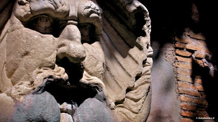 Aventine: Fountain with large mask outside of the Orange garden